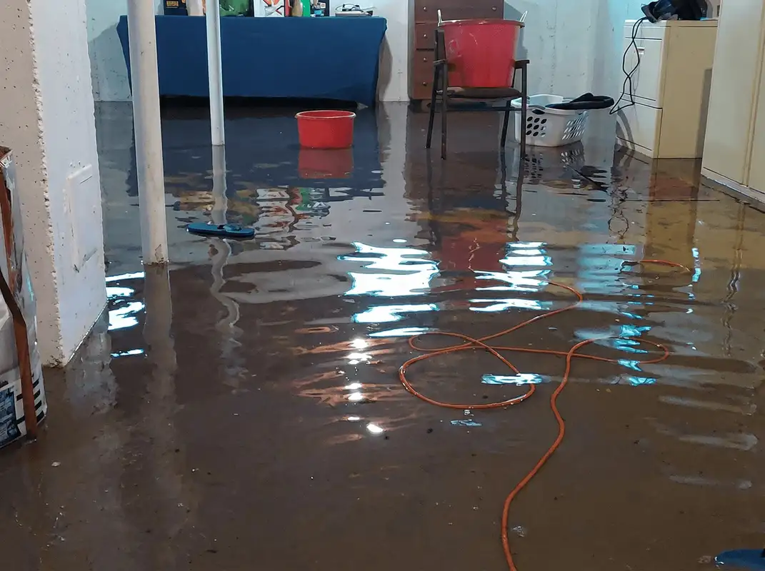 Basement with boiler, cabinets and washing machine completely flooded in Des Moines, IA